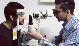 Optometrist performing an eye health check