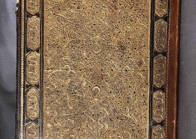 Persian manuscript with stunning binding, showcasing floral designs