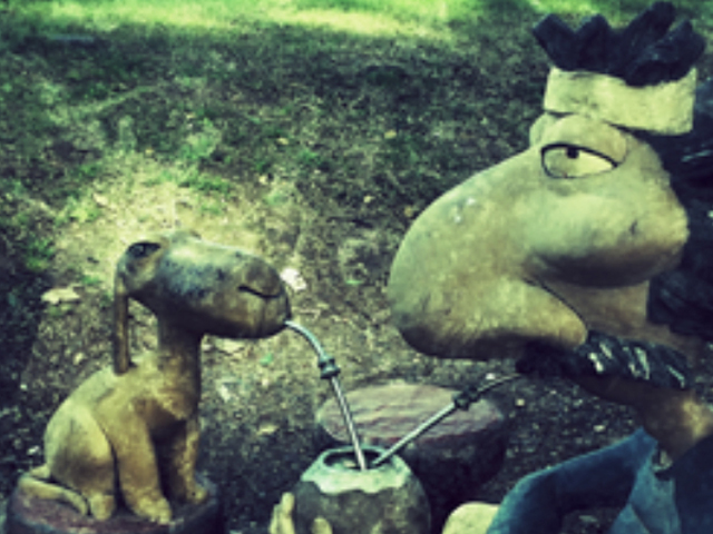 Still image from an animation - man and dog drinking a South American tea