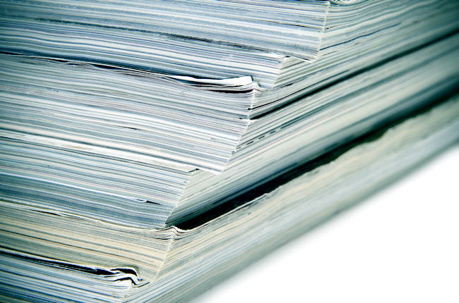 A photo of a stack of journals.