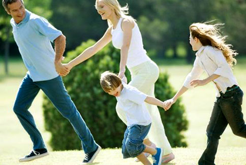 Parents and children running hand in hand