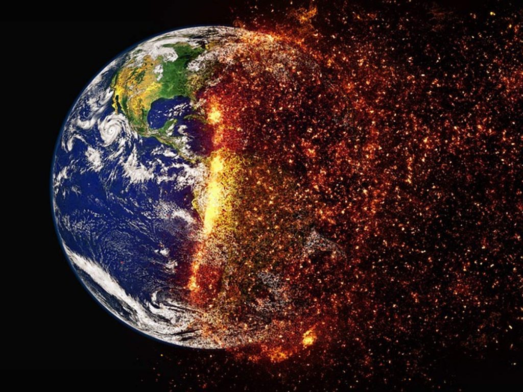 Earth, as viewed from space, with half of it apparently engulfed in flames