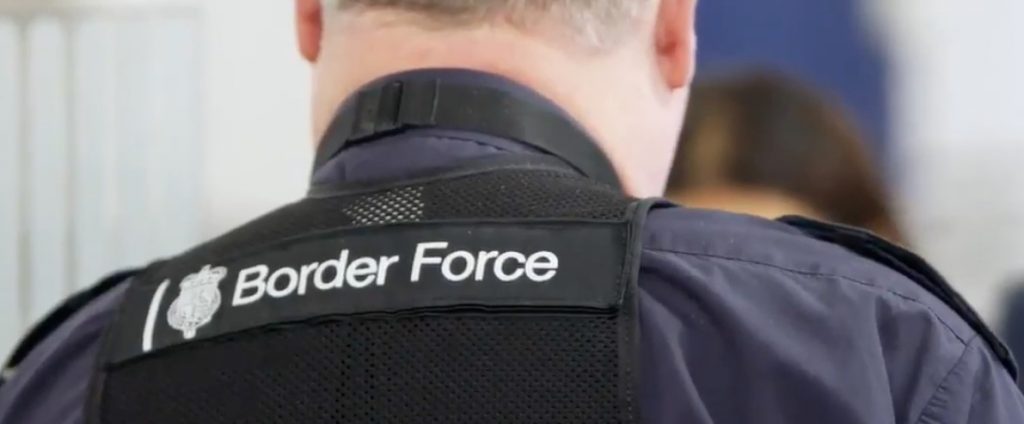 The back of a UK border force worker's head