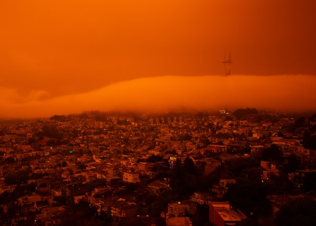 A sandstorm moves over a city.