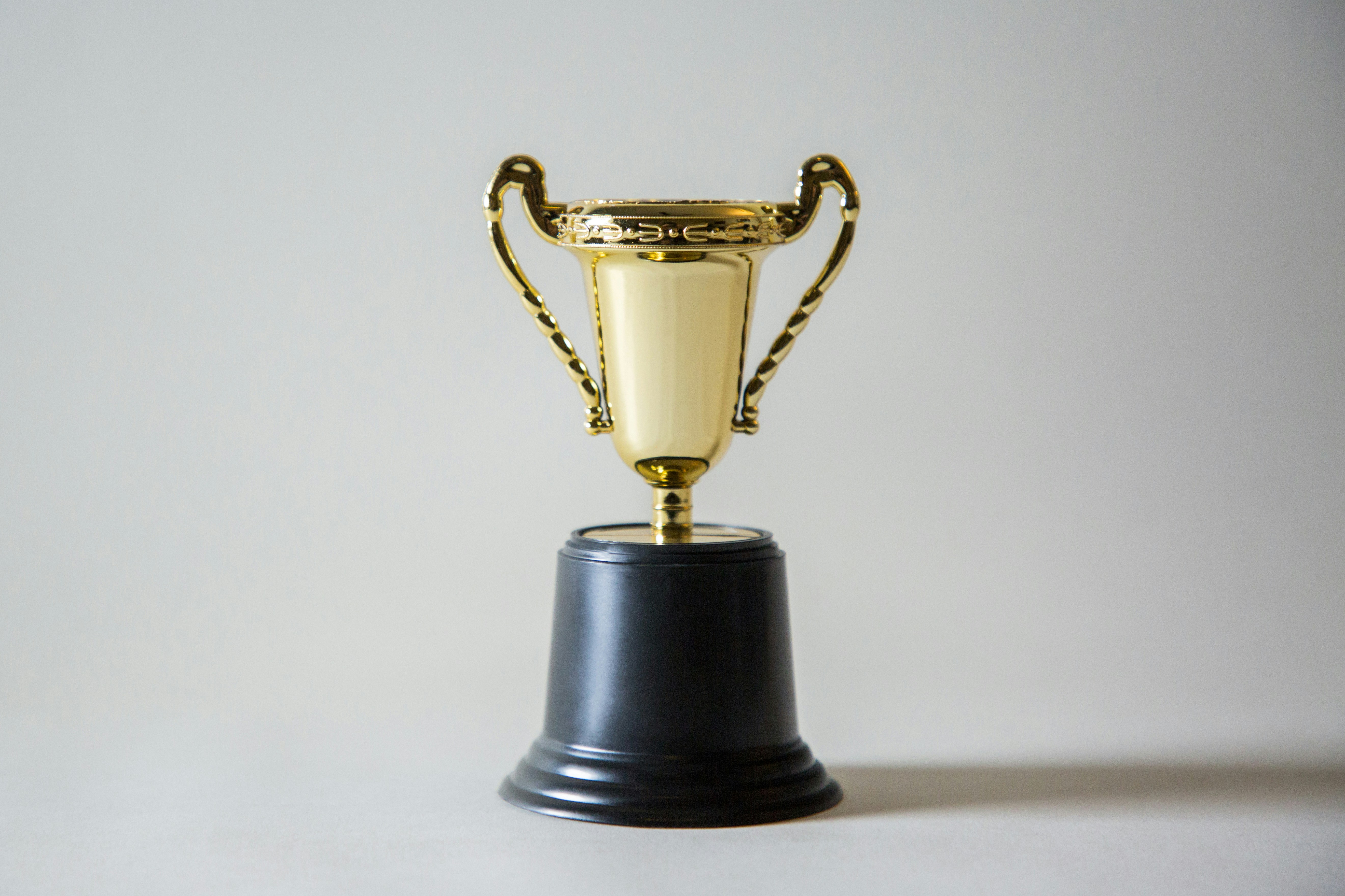 giorgio-trovato-_XTY6lD8jgM-unsplash A gold trophy