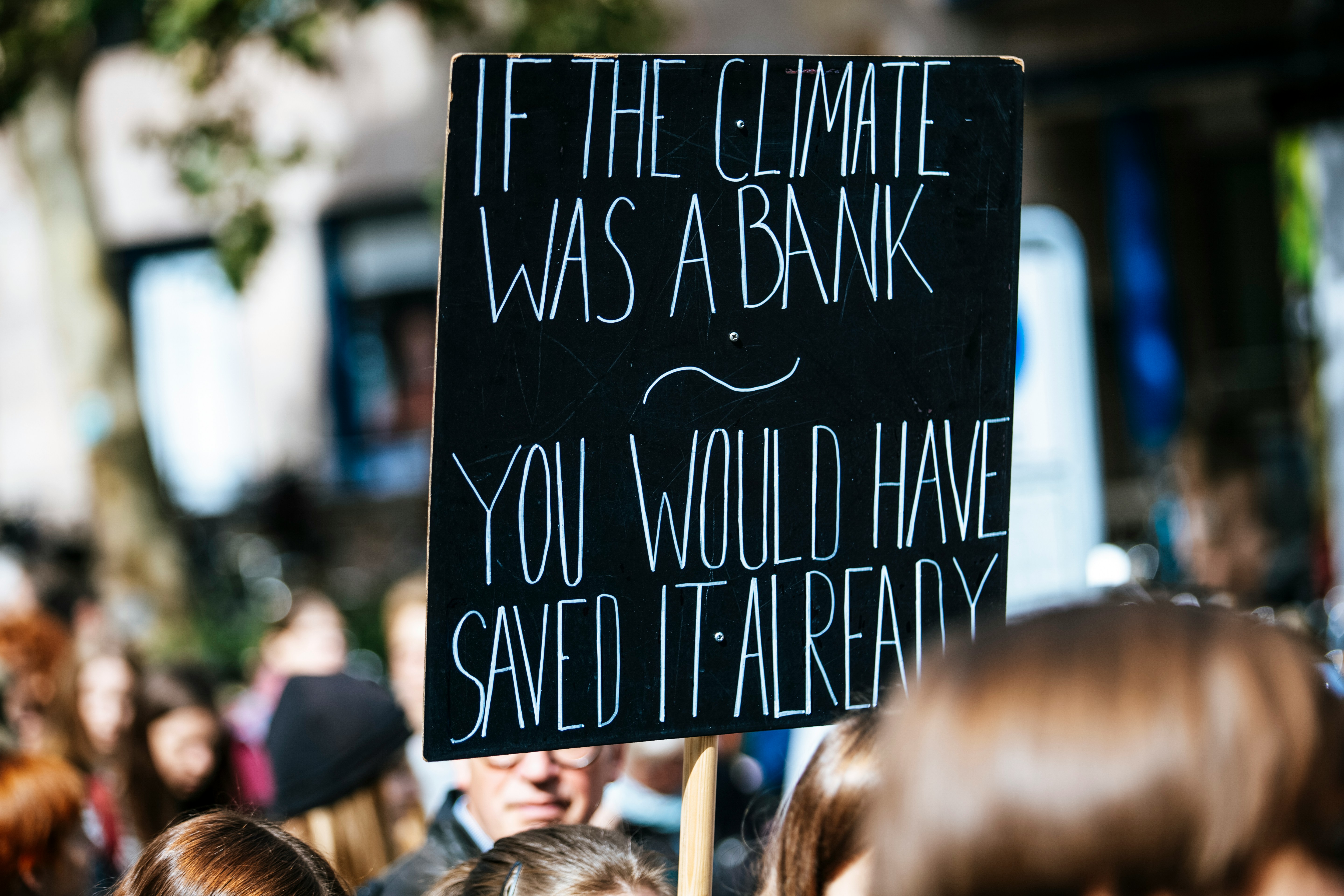 Evie A sign saying 'if the climate was a bank you would have saved it already'