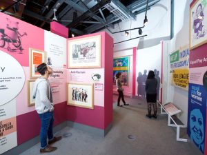 A student looking around an equality exhibition