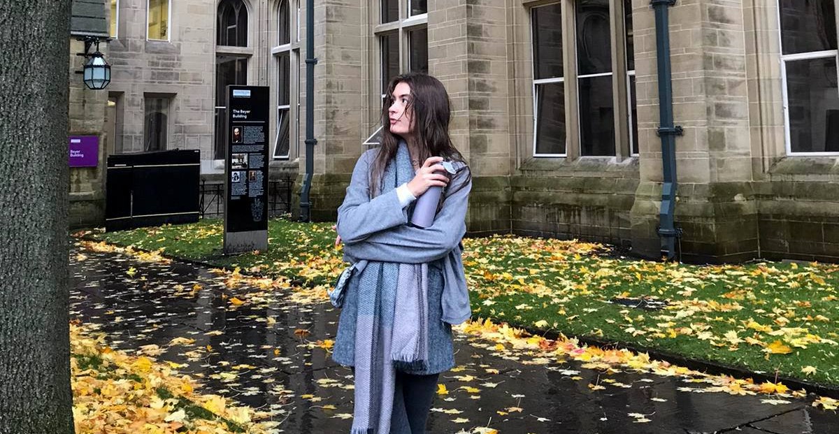 adelina Girl standing in front of the University of Manchester building
