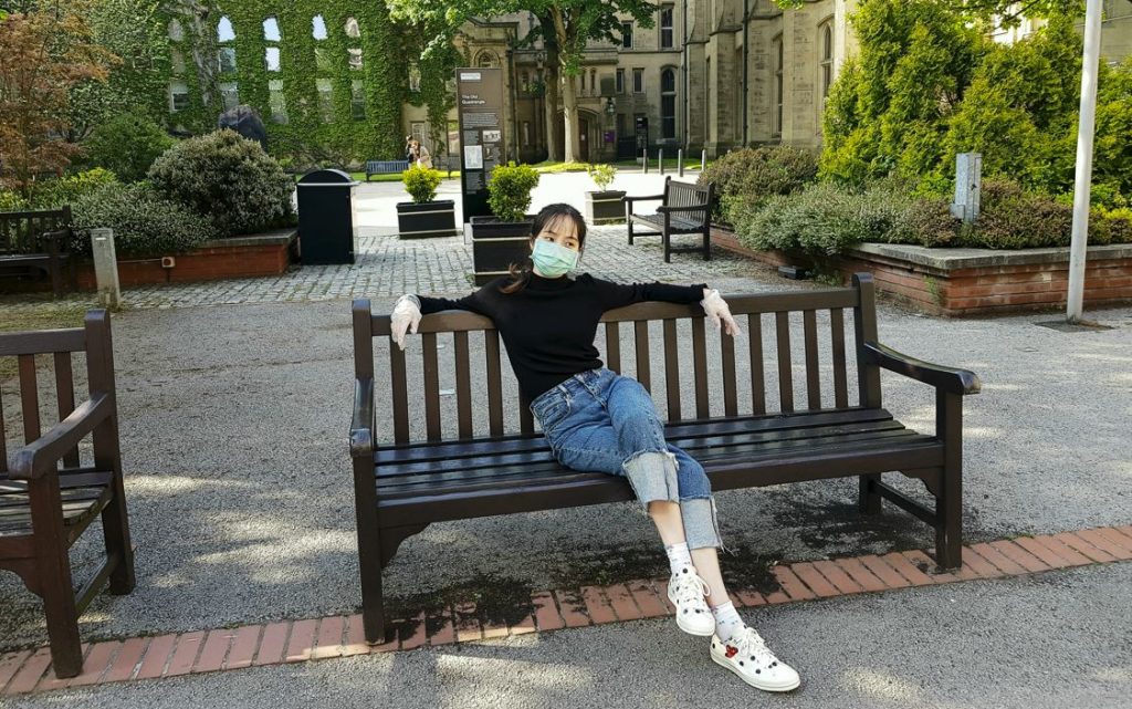 Alice sat on a bench on the university campus