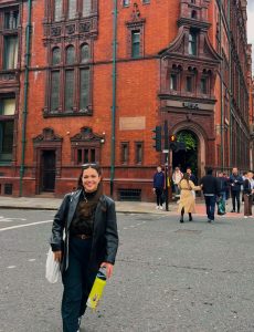 Julia walking in Street of Manchester city