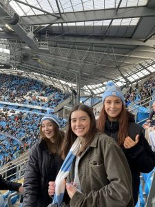 Emily with friends at the stadium