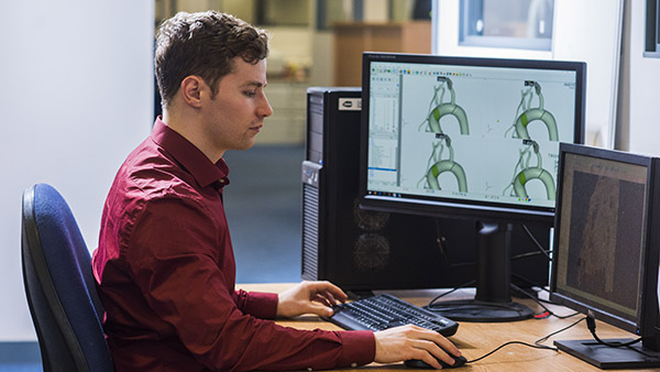 Male researcher working on a simulation of cardiovascular healthcare