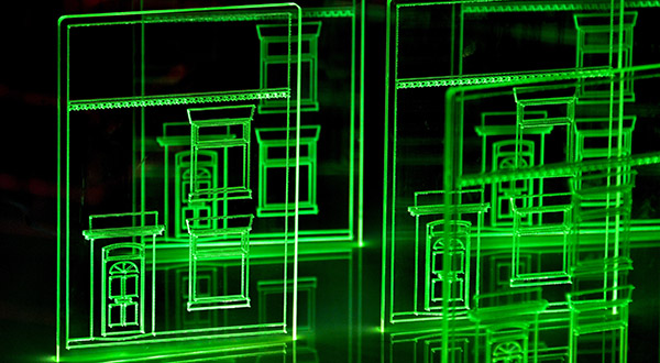 Computer simulation of urban planning showing green outlines on a black background