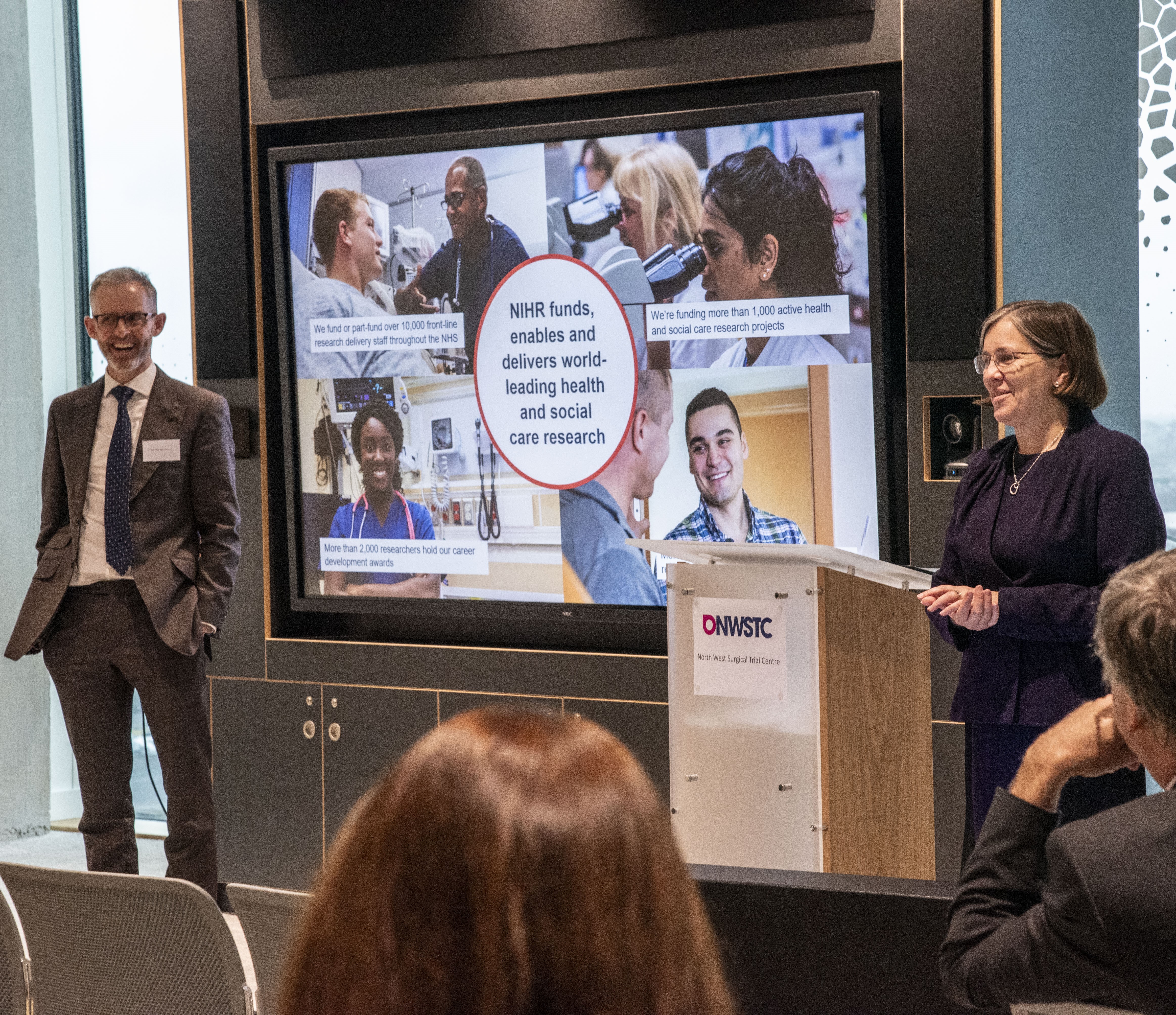 People presenting at a conference