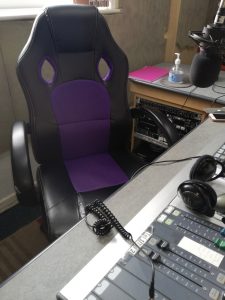Mixing desk, headphones, and chair in the Crescent Community Radio studio