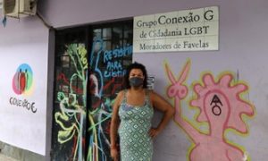Grupo Conexão G de Cidadania LGBT de Favelas entrance and their Executive Director, Gilmara Cunha.