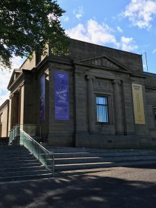 Image of the Sheffield Weston Park Museum exterior with hung banner of 'Brought to Light' event