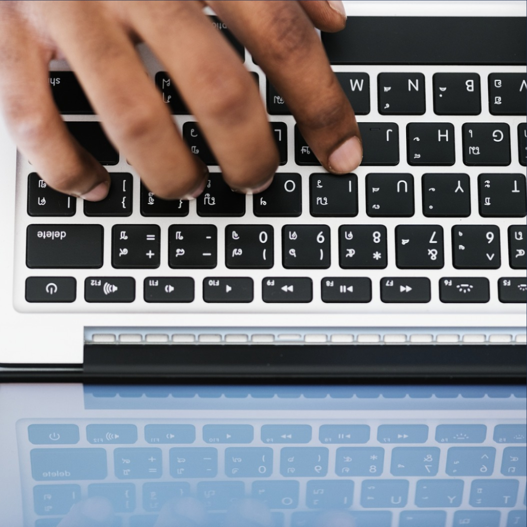 image of hands on keyboard