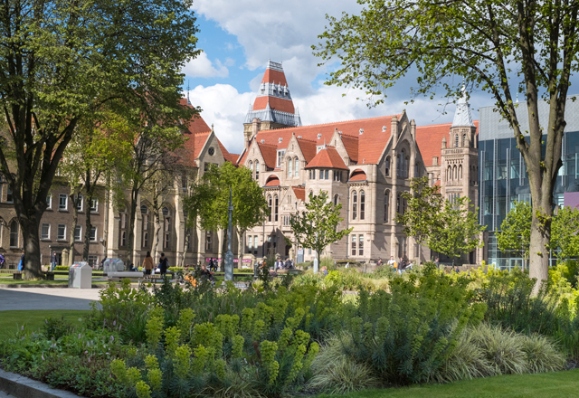 A photograph of the main University of Manchester building and surrounding campus