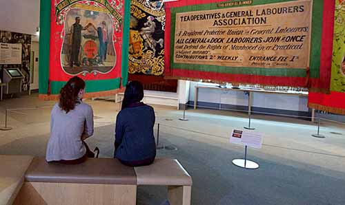 Two students at a workers' history exhibition