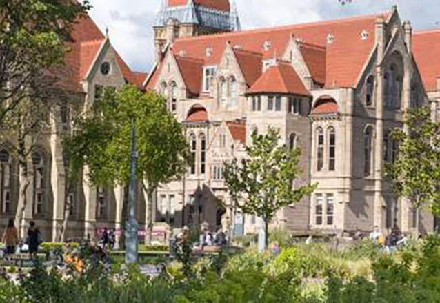 A photograph of the main University of Manchester building and surrounding campus