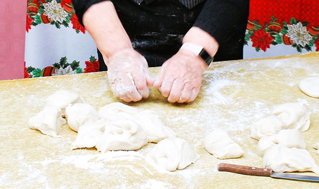 hands making bread